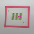 A square white embroidery canvas with a bright pink stitched border, featuring green vertical stripes, pink text reading 'NDEBT', and a small pink 'CD' in the lower right, shown on a plain light gray background.